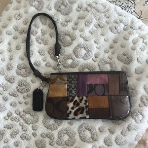Gently used Coach wristlet. Multicolored and textured.